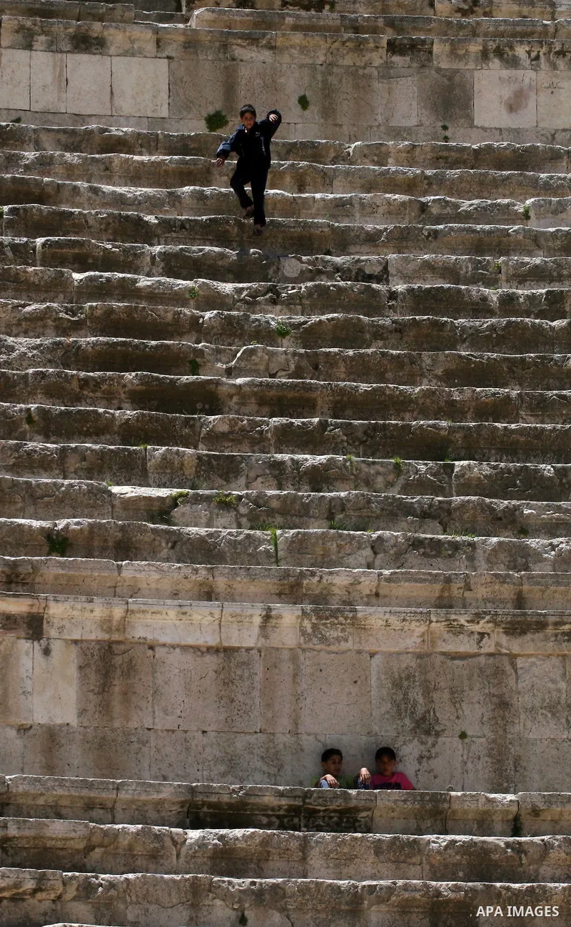 Foreign tourists in the Roman amphitheatre in Amman, Jordan, June 2, 2012. Amphitheatre of the most important Roman monuments in Amman, was built 161 years AD. Photo by Issam Rimawi