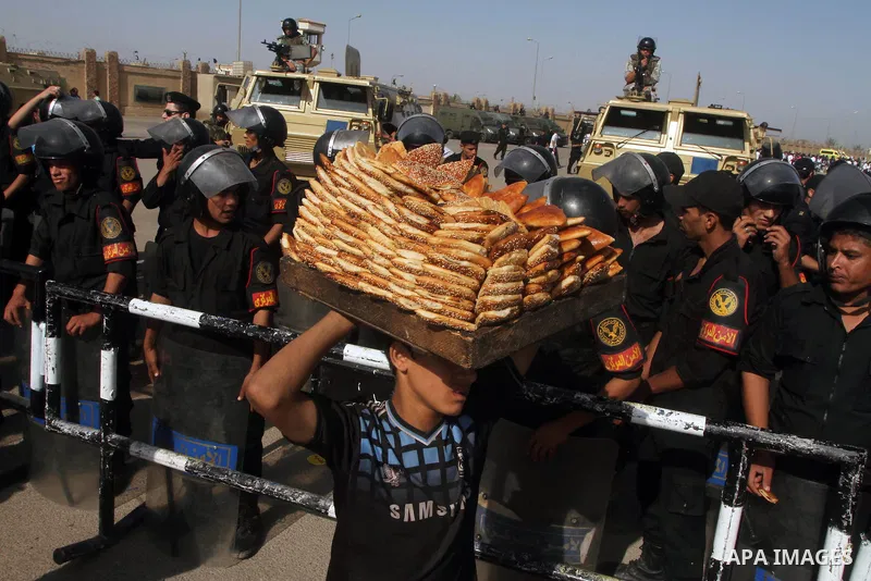 Egyptian riot police stand in front of the courthouse where ex-President Hosni Mubarak received a verdict in his trial for charges related to the death of protesters in Cairo, Egypt, Saturday, May 2, 2012. Egypt's ex-Pre...