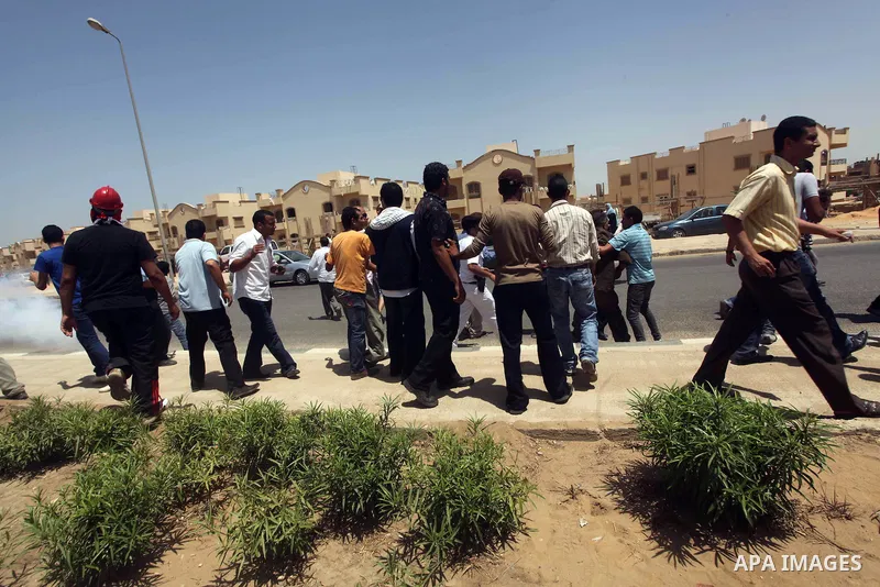Anti-Mubarak protesters clash with riot police after a court sentenced deposed president Hosni Mubarak to life in prison, outside the police academy where the court is located in Cairo June 2, 2012. Mubarak was sentenced...