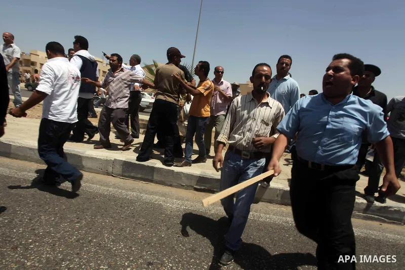 Anti-Mubarak protesters clash with riot police after a court sentenced deposed president Hosni Mubarak to life in prison, outside the police academy where the court is located in Cairo June 2, 2012. Mubarak was sentenced...