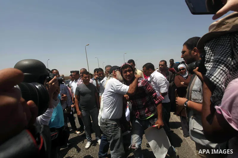 Relatives of people who died during Egypt's revolution react after a court sentenced deposed president Hosni Mubarak to life in prison, outside the police academy where the court is located in Cairo June 2, 2012. Mubarak...