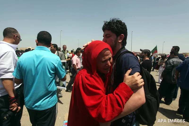 Relatives of people who died during Egypt's revolution react after a court sentenced deposed president Hosni Mubarak to life in prison, outside the police academy where the court is located in Cairo June 2, 2012. Mubarak...