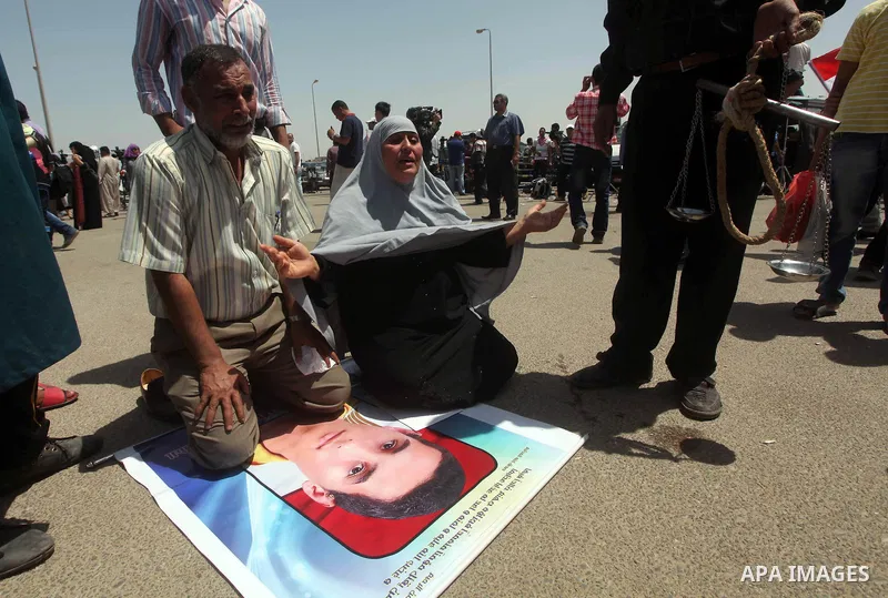 Relatives of people who died during Egypt's revolution react after a court sentenced deposed president Hosni Mubarak to life in prison, outside the police academy where the court is located in Cairo June 2, 2012. Mubarak...