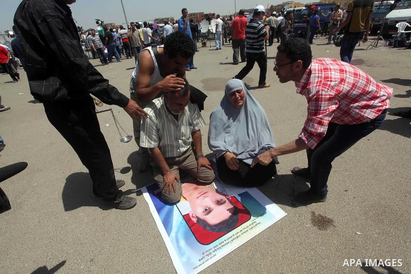 Relatives of people who died during Egypt's revolution react after a court sentenced deposed president Hosni Mubarak to life in prison, outside the police academy where the court is located in Cairo June 2, 2012. Mubarak...
