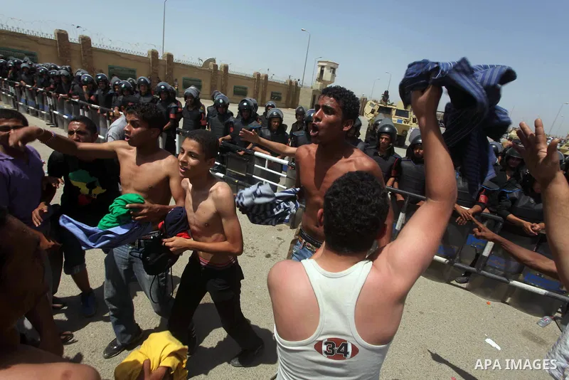 Anti-Mubarak protesters clash with riot police after a court sentenced deposed president Hosni Mubarak to life in prison, outside the police academy where the court is located in Cairo June 2, 2012. Mubarak was sentenced...