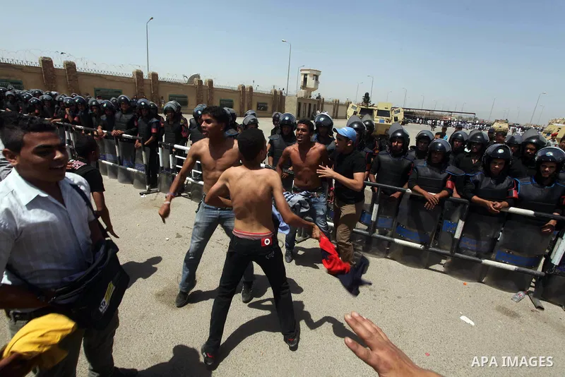 Relatives of people who died during Egypt's revolution react after a court sentenced deposed president Hosni Mubarak to life in prison, outside the police academy where the court is located in Cairo June 2, 2012. Mubarak...