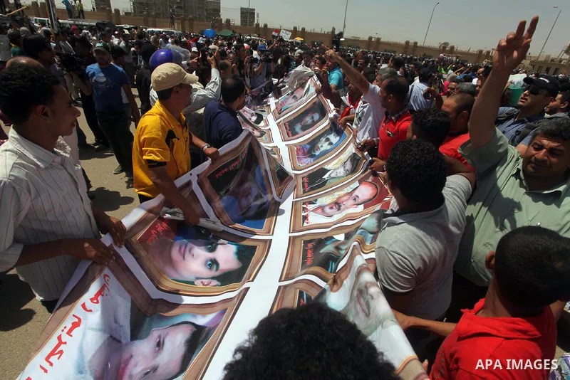Relatives of people who died during Egypt's revolution react after a court sentenced deposed president Hosni Mubarak to life in prison, outside the police academy where the court is located in Cairo June 2, 2012. Mubarak...
