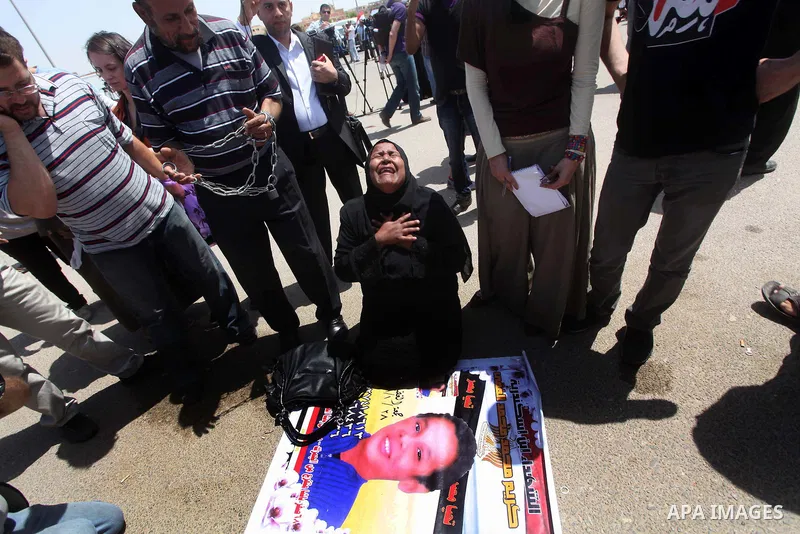 Relatives of people who died during Egypt's revolution react after a court sentenced deposed president Hosni Mubarak to life in prison, outside the police academy where the court is located in Cairo June 2, 2012. Mubarak...