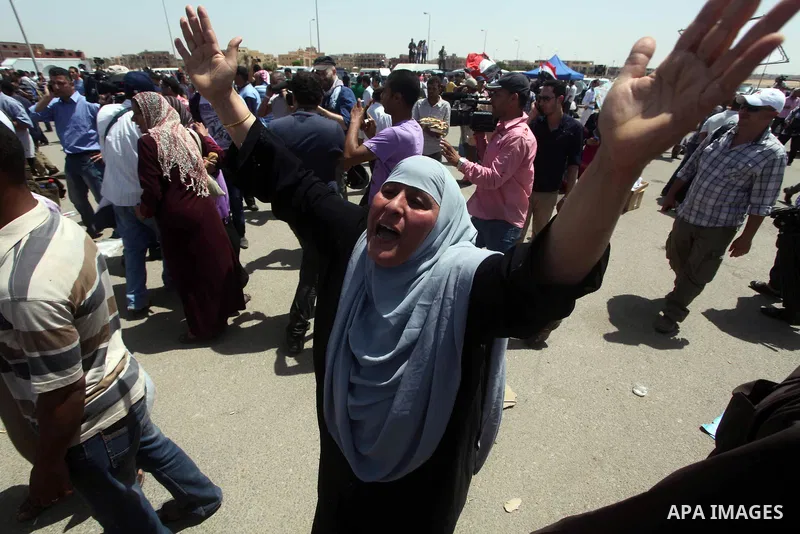 Relatives of people who died during Egypt's revolution react after a court sentenced deposed president Hosni Mubarak to life in prison, outside the police academy where the court is located in Cairo June 2, 2012. Mubarak...