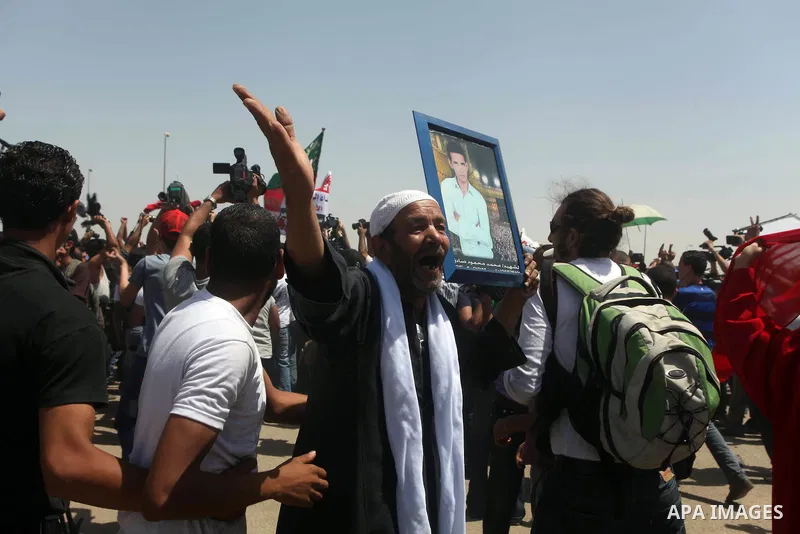 Relatives of people who died during Egypt's revolution react after a court sentenced deposed president Hosni Mubarak to life in prison, outside the police academy where the court is located in Cairo June 2, 2012. Mubarak...