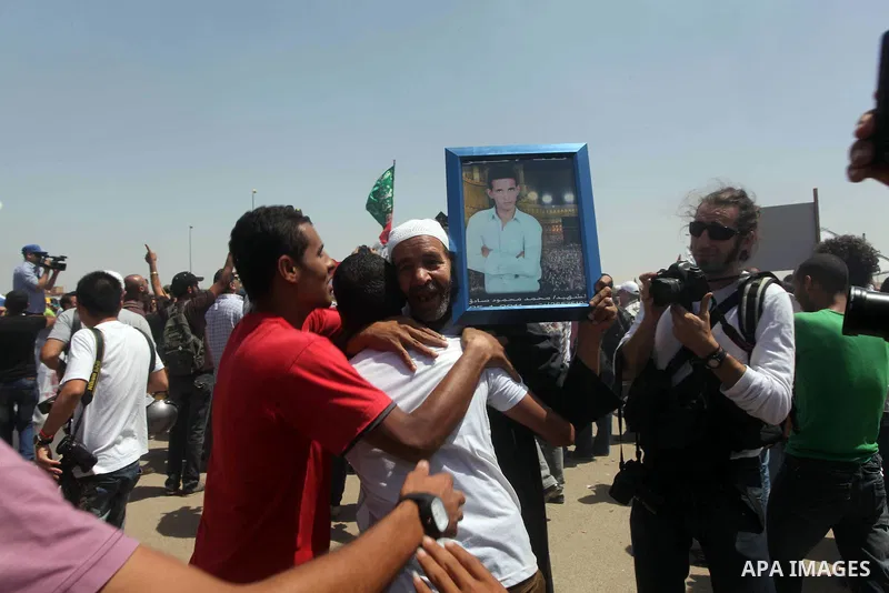 Relatives of people who died during Egypt's revolution react after a court sentenced deposed president Hosni Mubarak to life in prison, outside the police academy where the court is located in Cairo June 2, 2012. Mubarak...