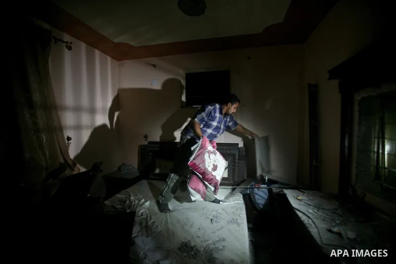 A Palestinian man inspects a destroyed house after an Israeli missile strike in Al-Nussirat Refugee Camp in central Gaza Strip, 03 June 2012. According to news reports, seven Palestinians were wounded in a series of Isra...