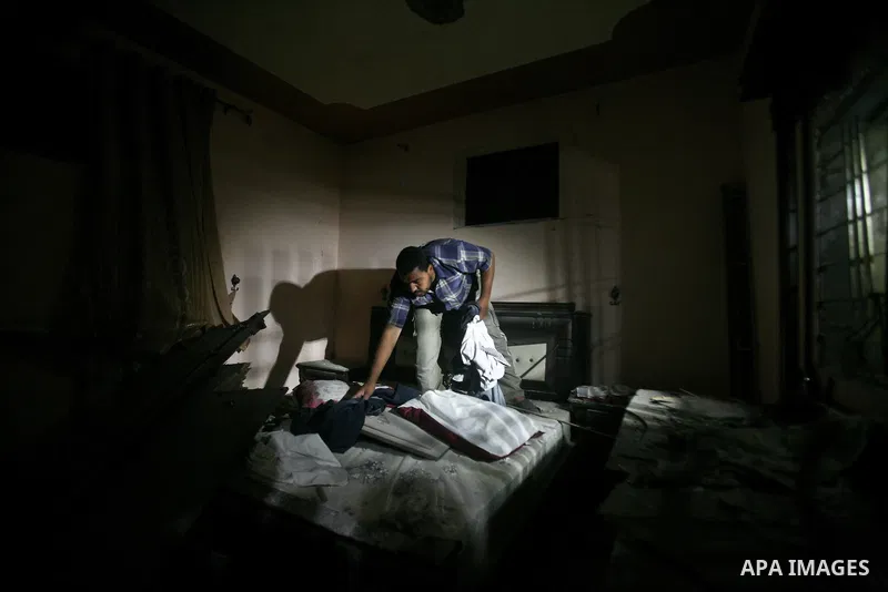 A Palestinian man inspects a destroyed house after an Israeli missile strike in Al-Nussirat Refugee Camp in central Gaza Strip, 03 June 2012. According to news reports, seven Palestinians were wounded in a series of Isra...