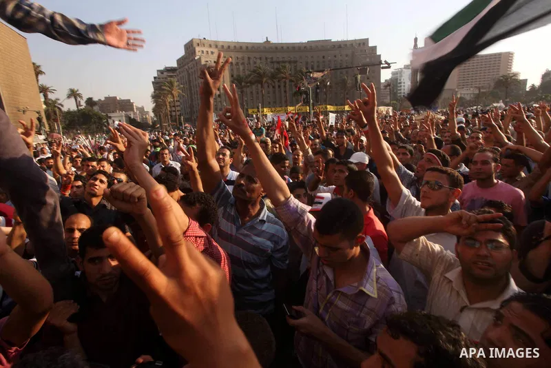 Protesters wave Egypt's flags during a demonstration at Tahrir square in Cairo, against the verdict for deposed leader Hosni Mubarak June 4, 2012. Egyptian pro-democracy campaigners called on Sunday for a new uprising, s...