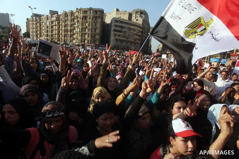 Protesters wave Egypt's flags during a demonstration at Tahrir square in Cairo, against the verdict for deposed leader Hosni Mubarak June 4, 2012. Egyptian pro-democracy campaigners called on Sunday for a new uprising, s...