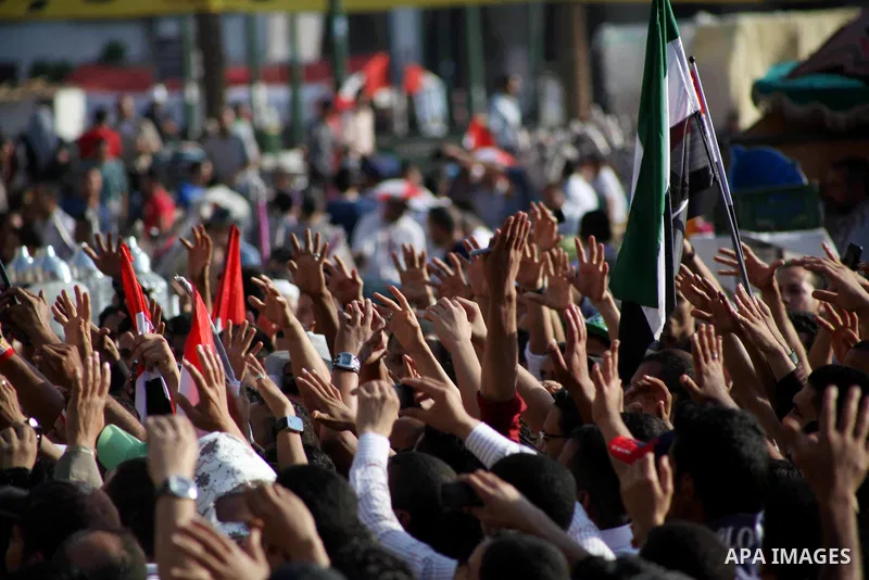 Protesters wave Egypt's flags during a demonstration at Tahrir square in Cairo, against the verdict for deposed leader Hosni Mubarak June 4, 2012. Egyptian pro-democracy campaigners called on Sunday for a new uprising, s...