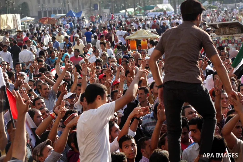 Protesters wave Egypt's flags during a demonstration at Tahrir square in Cairo, against the verdict for deposed leader Hosni Mubarak June 4, 2012. Egyptian pro-democracy campaigners called on Sunday for a new uprising, s...