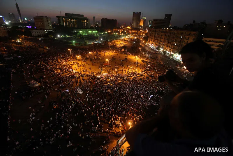 Protesters wave Egypt's flags during a demonstration at Tahrir square in Cairo, against the verdict for deposed leader Hosni Mubarak June 4, 2012. Egyptian pro-democracy campaigners called on Sunday for a new uprising, s...