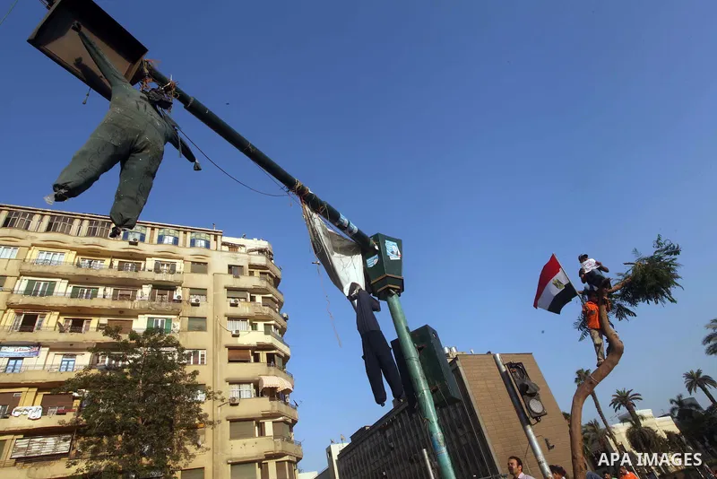 Protesters wave Egypt's flags during a demonstration at Tahrir square in Cairo, against the verdict for deposed leader Hosni Mubarak June 4, 2012. Egyptian pro-democracy campaigners called on Sunday for a new uprising, s...