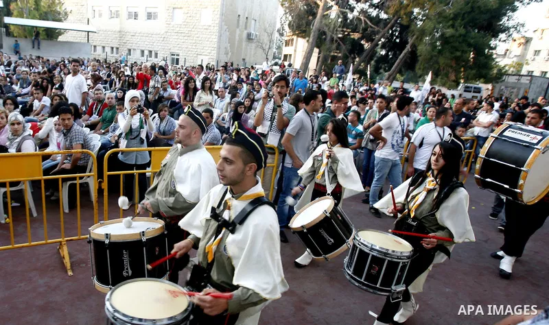 Palestinians watch a ceremony and performance commemorating the 1967 setback in Jerusalem on June 04,2012. Students movement homeland of the Hebrew University salutes the anniversary of the setback in 1967. The setback i...