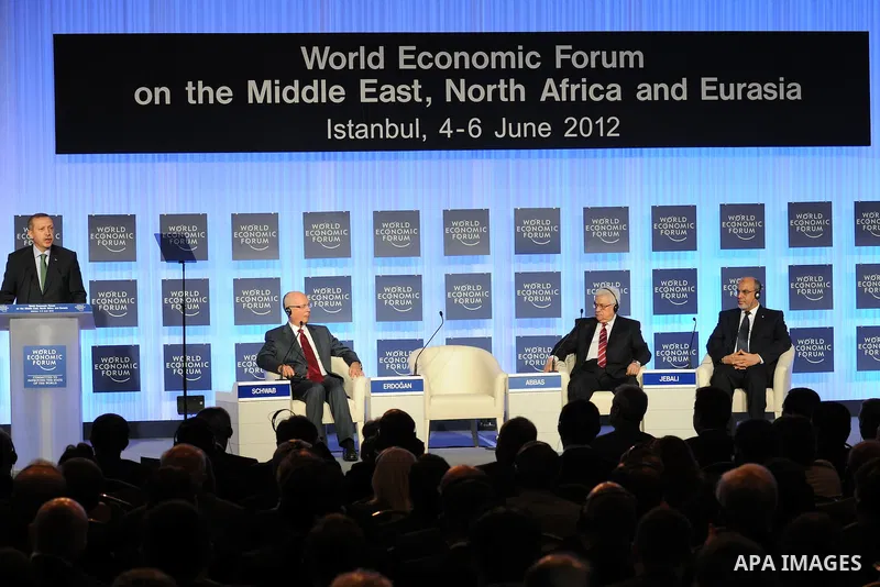 Turkish Prime Minister Recep Tayyip Erdogan (L-R) addresses the participants at the World Economic Forum (WEF) on the Middle East, North Africa and Eurasia 2012, as WEF's founder and executive chairman Klaus Schwab, Pale...