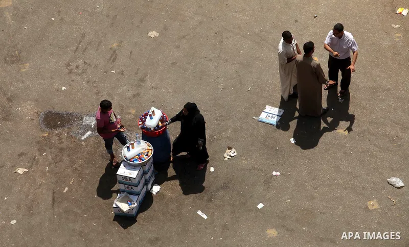 Egyptians walk at Tahrir square, Cairo, Egypt, 05 June 2012. Opposition groups have called for mass protests on 05 June against the verdict in the trial of Mubarak and security aides and against the candidacy of Ahmed Sh...