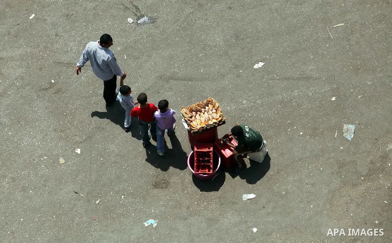 Egyptians walk at Tahrir square, Cairo, Egypt, 05 June 2012. Opposition groups have called for mass protests on 05 June against the verdict in the trial of Mubarak and security aides and against the candidacy of Ahmed Sh...