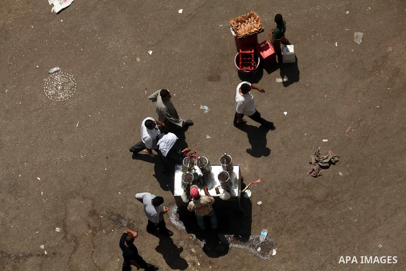 Egyptians walk at Tahrir square, Cairo, Egypt, 05 June 2012. Opposition groups have called for mass protests on 05 June against the verdict in the trial of Mubarak and security aides and against the candidacy of Ahmed Sh...