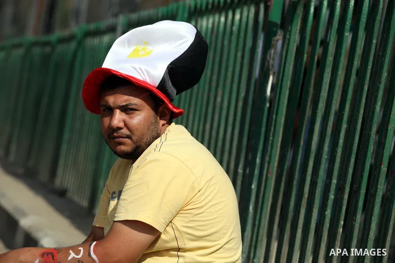 An Egyptian sets a cap of national flag during a demonstration at Tahrir square in Cairo June 5, 2012. Activists urged Egyptians to turn out for a big protest on Tuesday to reclaim a revolt they say has been hijacked aft...