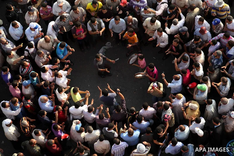 Egyptian protesters wave national flags during a demonstration in Cairo's landmark Tahrir Square on June 5, 2012 to protest against verdicts handed down in ex-president Hosni Mubarak's murder trial. Mubarak and his inter...