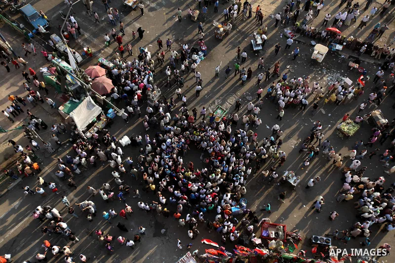 Egyptian protesters wave national flags during a demonstration in Cairo's landmark Tahrir Square on June 5, 2012 to protest against verdicts handed down in ex-president Hosni Mubarak's murder trial. Mubarak and his inter...
