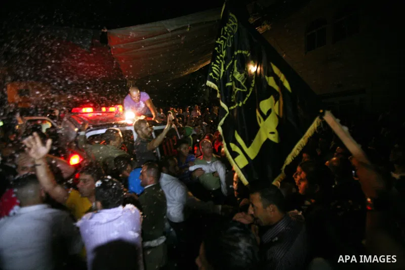 Palestinians celebrate after the Israeli authorities released prisoner Thaer Halahleh in the West Bank Village of Kharas near Hebron on June 05, 2012. Thaer Halahla, 33, from Hebron was in administrative detention for th...