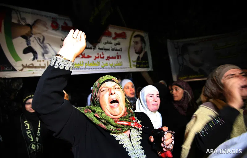 Palestinians celebrate after the Israeli authorities released prisoner Thaer Halahleh in the West Bank Village of Kharas near Hebron on June 05, 2012. Thaer Halahla, 33, from Hebron was in administrative detention for th...