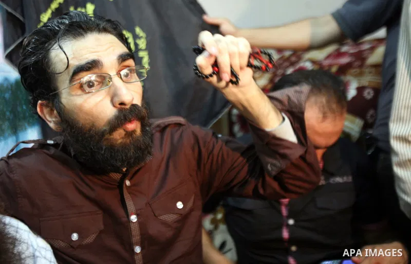 Thaer Halahleh talks to press after the Israeli authorities released him in the West Bank Village of Kharas near Hebron on June 05, 2012. Thaer Halahla, 33, from Hebron was in administrative detention for the past 24 mon...