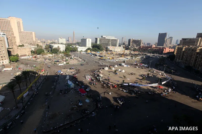 Egyptian protesters clean the street in Cairo's landmark Tahrir Square on June 6, 2012, the day after people demonstrated to protest against verdicts handed down in ex-president Hosni Mubarak's murder trial. Photo by Maj...