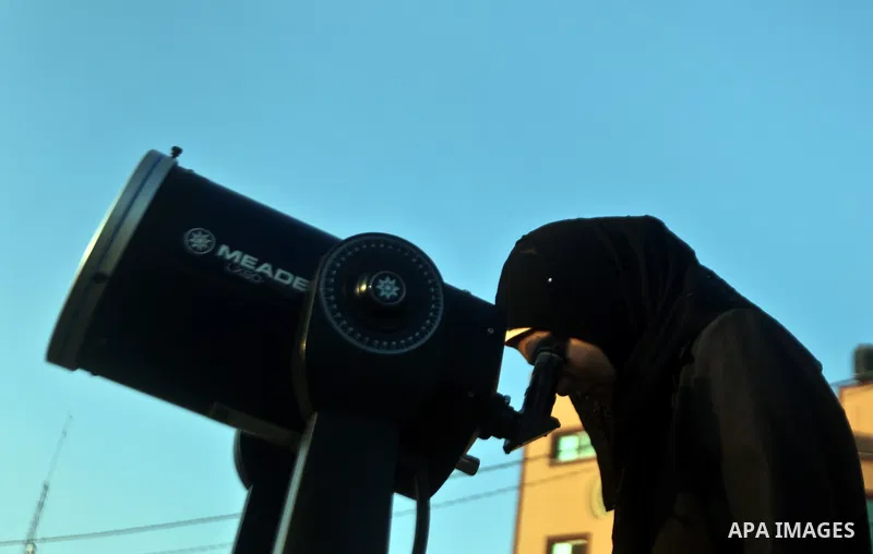 Palestinians look through a telescopes during the transit of planet Venus across the sun face during a rare celestial event in the Gaza Strip, 06 June 2012. Astronomy enthusiasts all over the world looked to the skies to...