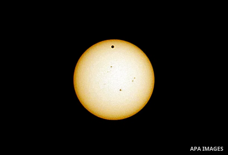 The planet Venus is pictured as it crosses the Sun's face during a rare celestial event in Gaza Strip, 06 June 2012. Astronomy enthusiasts all over the world looked to the skies to watch the planet Venus crawl across the...