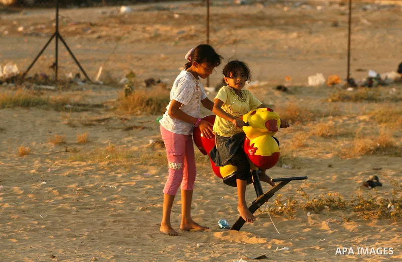Palestinian children play at a park during the summer holiday in the Rafah refugee camp southern Gaza Strip on June 07, 2012. Photo by Eyad Al Baba