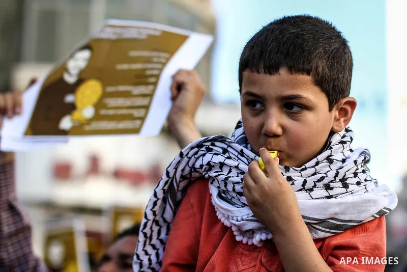 Palestinian child blows his whistle during a rally solidarity with Palestinian prisoner Mahmoud al-Sarsak who is still refusing food after a deal was made to end a mass prisoner hunger strike, on 07 June 2012. Mahmoud Sa...