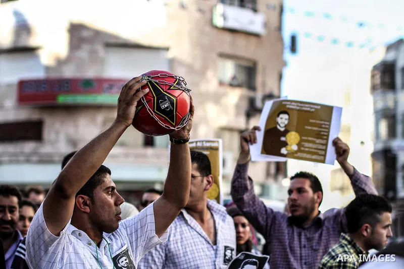 Palestinian youth play football in the streets of Ramallah during a rally solidarity with Palestinian prisoner Mahmoud Al-Sarsak who is still refusing food after a deal was made to end a mass prisoner hunger strike, on 0...