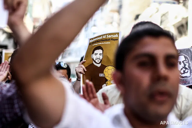 Palestinians shout slogans during a rally solidarity with Palestinian prisoner Mahmoud Al-Sarsak who is still refusing food after a deal was made to end a mass prisoner hunger strike, in the West Bank city of Ramallah on...