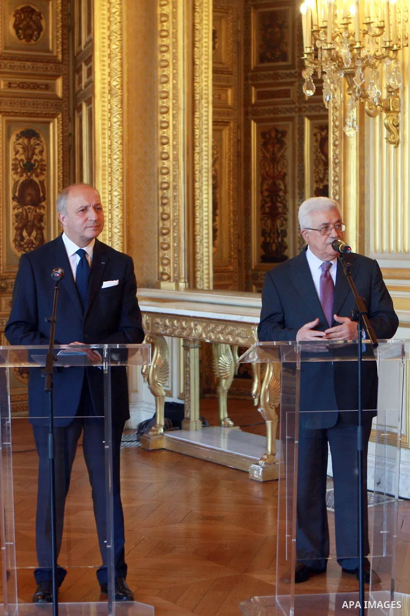 Palestinian President Mahmud Abbas meets with French Foreign Affairs Minister Laurent Fabius on June 7, 2012 at the Quai d'Orsay Ministry of Foreign Affairs in Paris. The two men are due to sign a convention for a financ...