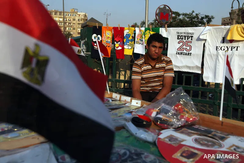 An Egyptian sells national flags at Cairo's Tahrir square on June 7, 2012. Thousands of Egyptians flocked to Cairo's iconic Tahrir square and other places on Thursday to protest the verdict handed down in ex-president Ho...