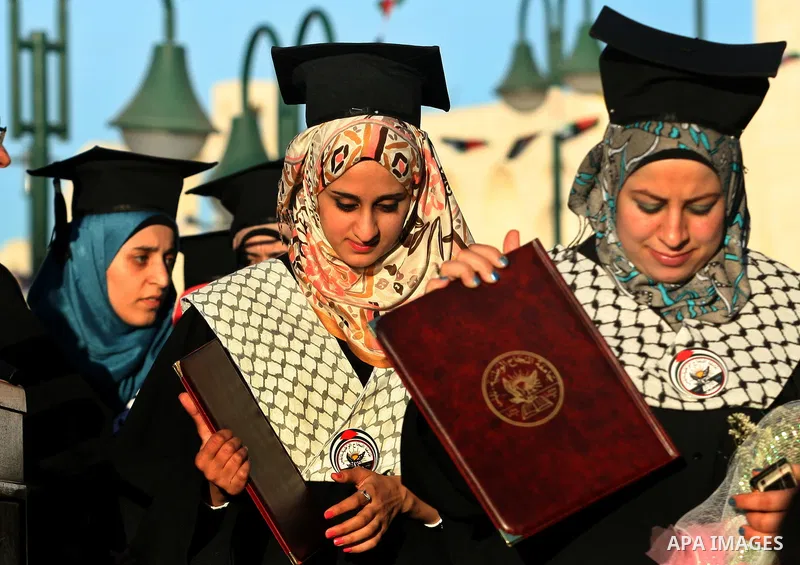Palestinian students celebrate during the 32nd Graduation Ceremony at Al - Najah University in The West Bank City of Nablus on 07 June 2012. Al - Najah University is a Palestinian non-governmental public university gover...