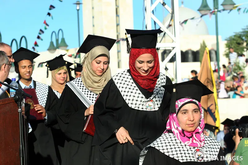 Palestinian students celebrate during the 32nd Graduation Ceremony at Al - Najah University in The West Bank City of Nablus on 07 June 2012. Al - Najah University is a Palestinian non-governmental public university gover...