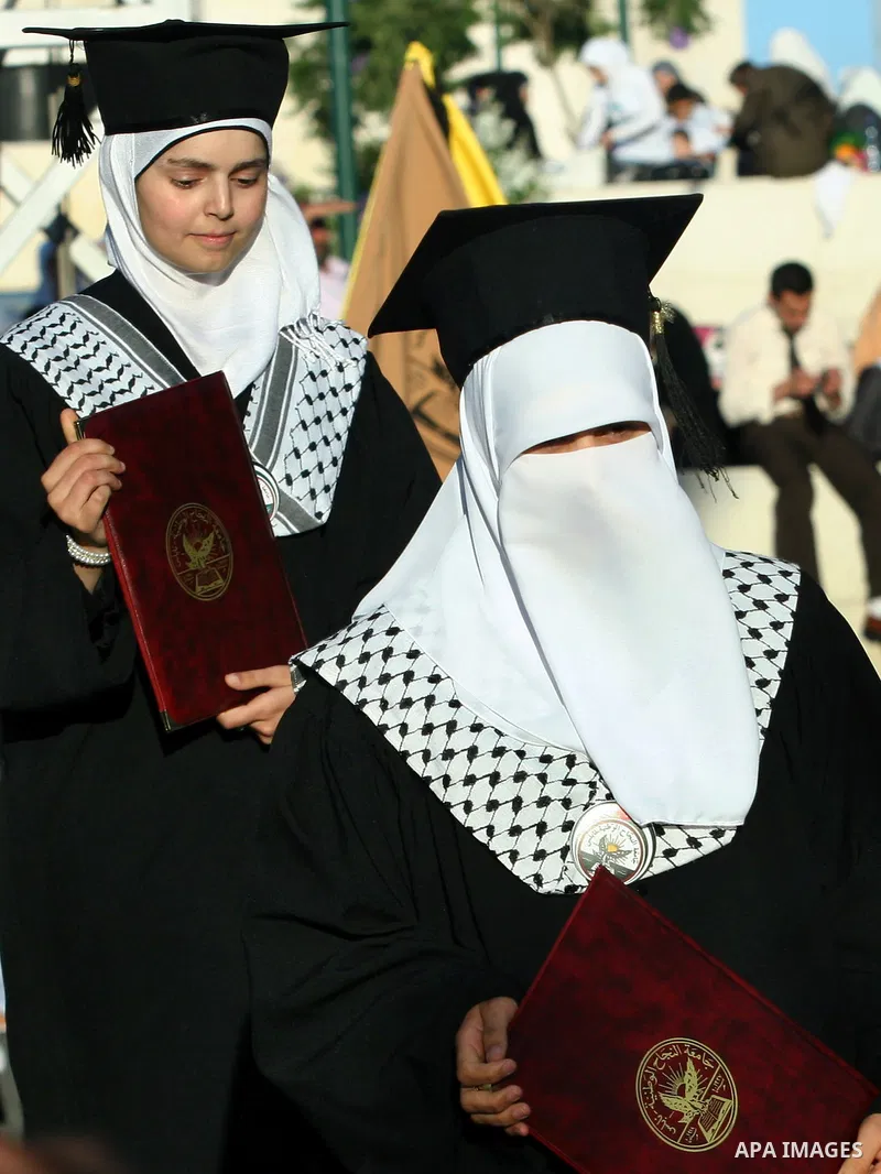 Palestinian students celebrate during the 32nd Graduation Ceremony at Al - Najah University in The West Bank City of Nablus on 07 June 2012. Al - Najah University is a Palestinian non-governmental public university gover...