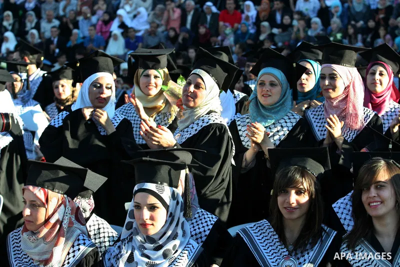 Palestinian students celebrate during the 32nd Graduation Ceremony at Al - Najah University in The West Bank City of Nablus on 07 June 2012. Al - Najah University is a Palestinian non-governmental public university gover...