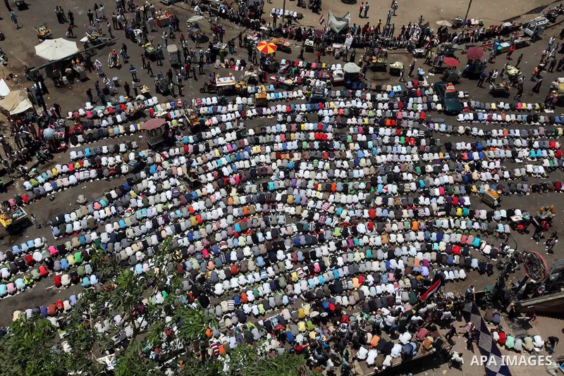 Egyptian Protesters gather for Friday prayers before a demonstration against presidential candidate Ahmed Shafiq in central Cairo's Tahrir Square, as hundreds of people gathered after the Friday noon prayer on June 8, 20...