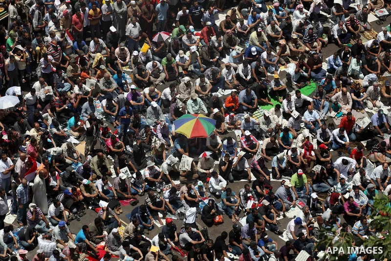 Egyptian Protesters gather for Friday prayers before a demonstration against presidential candidate Ahmed Shafiq in central Cairo's Tahrir Square, as hundreds of people gathered after the Friday noon prayer on June 8, 20...
