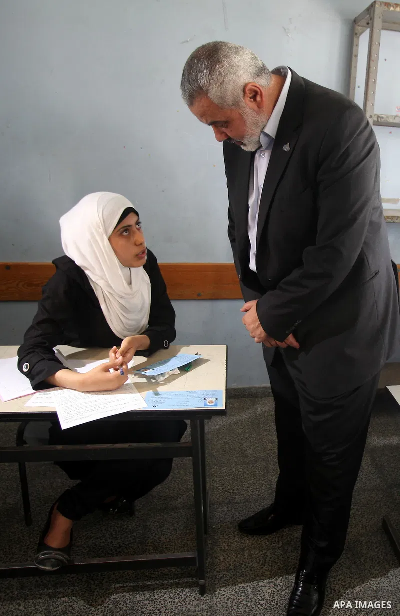 Palestinian Prime Minister in Gaza Strip, Ismail Haniya, visits students as they sit for their final high school exams, known as "Tawjihi", in Gaza City on June 09, 2012. Photo by Yasser Fathi